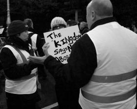 Vigil for Life stewards telling women she can't bring her own placard